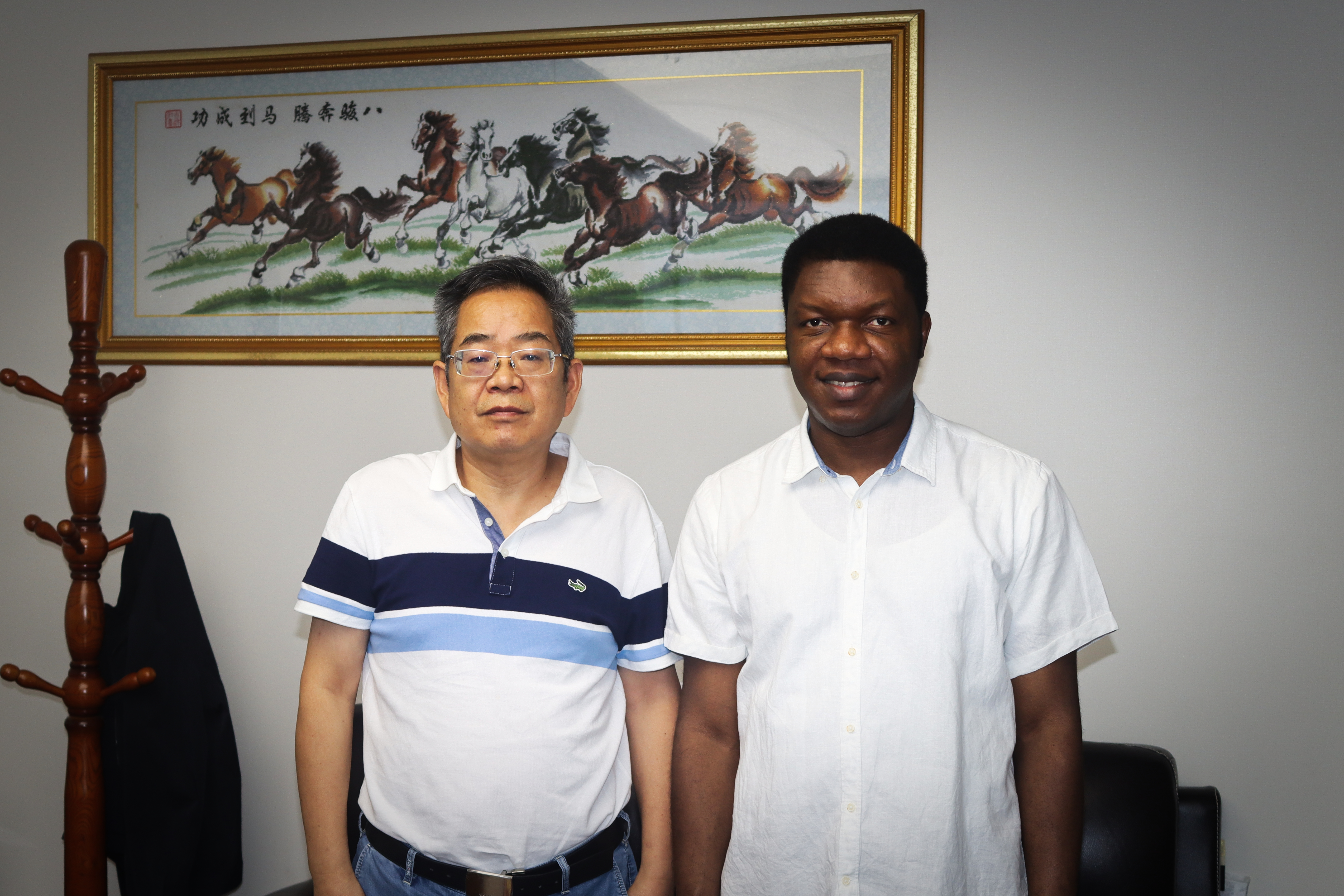 Moses Olabhele Esangbedo with Professor Bai Sijun, first postdoctoral supervisor and project management scholar